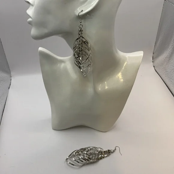 Stunning multi layered silver tone earrings faux diamond center. - Picture 2 of 3